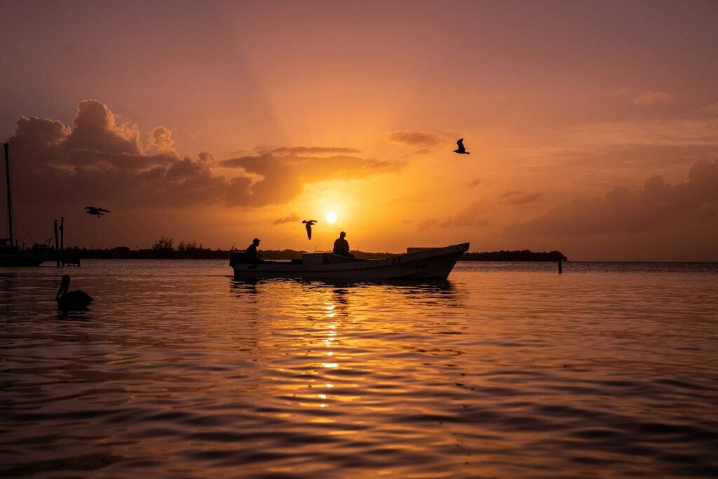 Boat at sunset on calm water